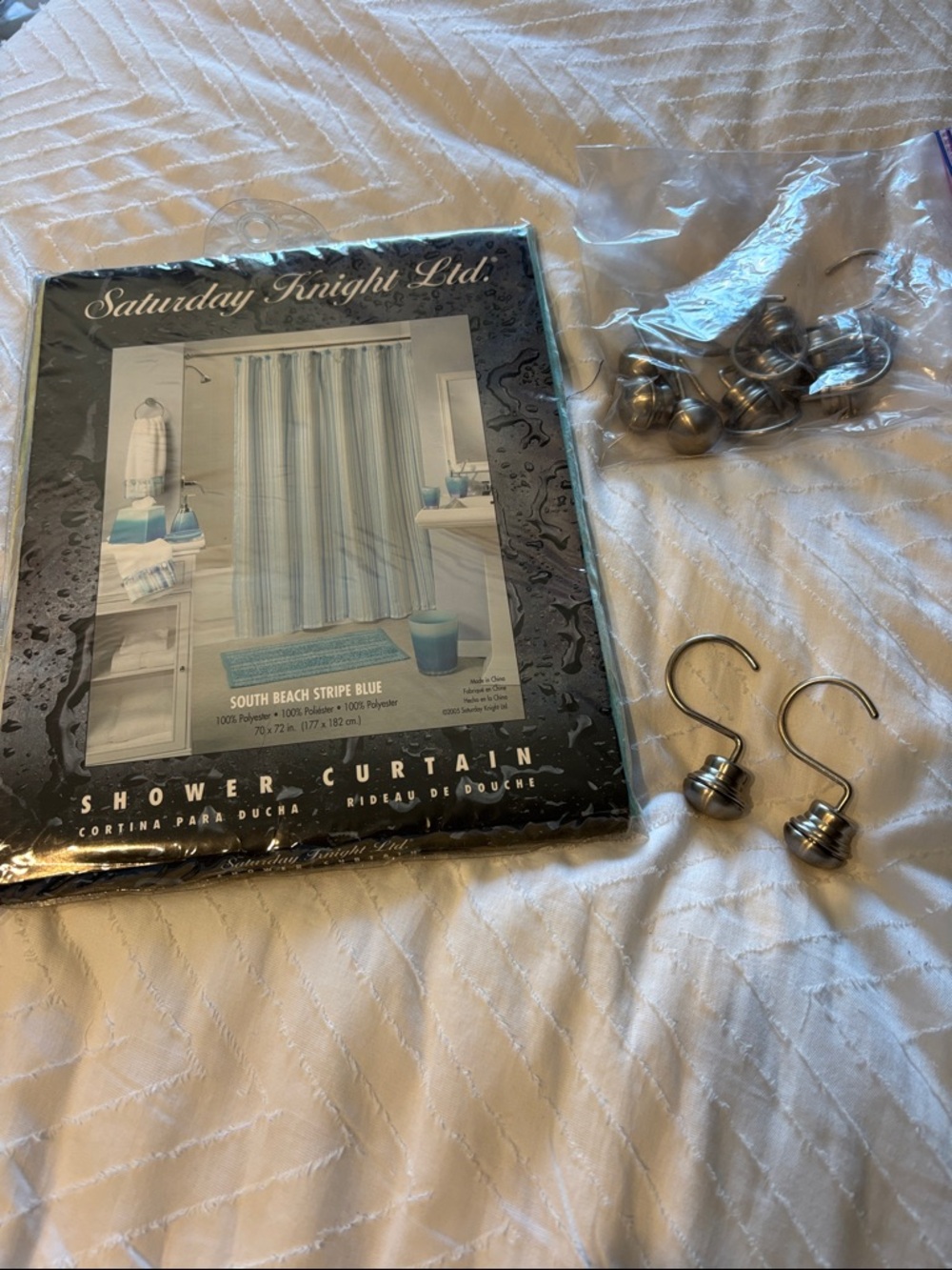 South Beach Stripe Blue Shower Curtain and curtain holders.